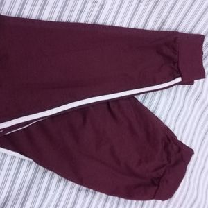 Maroon joggers with 2 white stripes